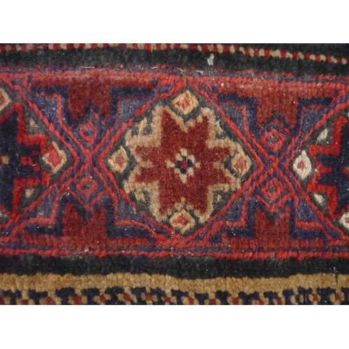 123 - 20th C Caucasian pattern runner, red ground, central geometric diamond motifs surrounded by floral p... 