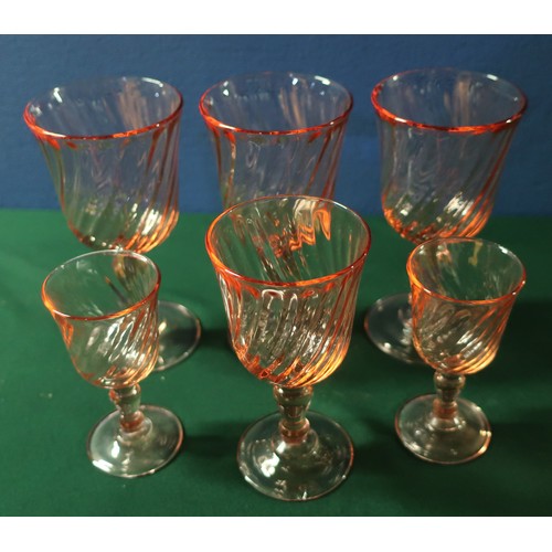 56 - Suite of rose tinted glassware including stemmed wine glasses, sherry, liquors etc