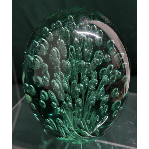 72 - Green coloured glass paperweights including bubble and floral inclusions (8)