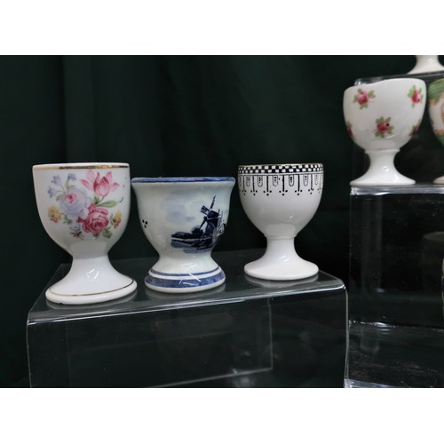 133 - Collection of egg cups including Mintons, Royal Doulton, Royal Cauldron, Paragon, Coalport, Royal Wo... 