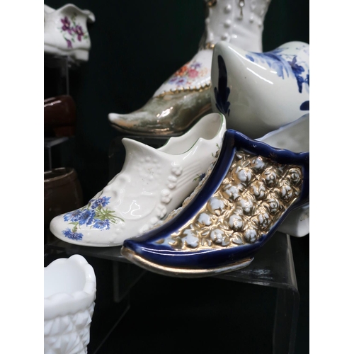 135 - Collection of miniature porcelain shoes, some of modern style and some of earlier fashions (2 boxes)