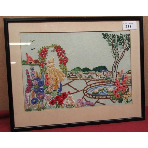 238 - 20th C needlepoint picture of a young girl in a cottage garden, F.M Sutcliffe, Whitby, vintage label... 