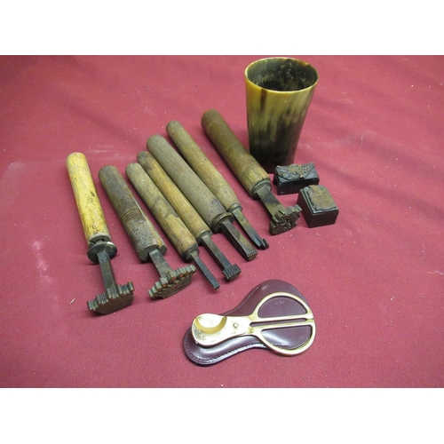 109 - Seven wooden mounted hand blocks set with coronets, two small printing blocks, a horn beaker etc