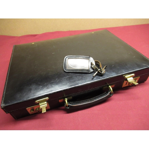 113 - Papworth of Cambridge black leather attache case with brass locks and clasps