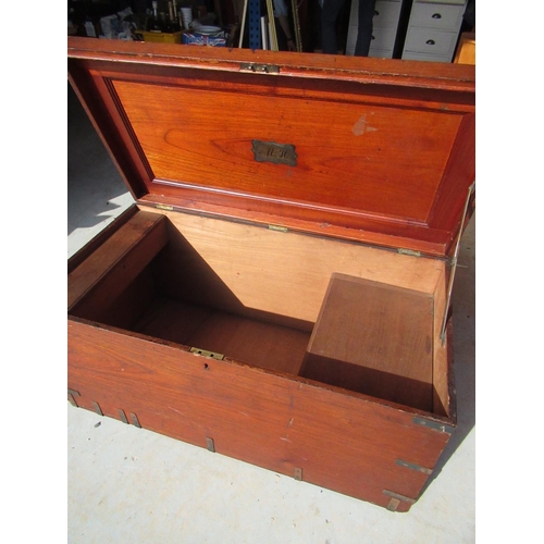 371 - Teak campaign style chest, the interior with two oak lidded compartments, the lid with an inset bras... 