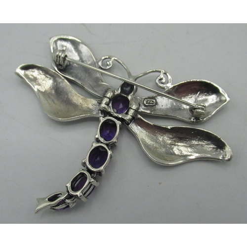 397 - Silver articulated butterfly brooch set with amethysts and marcasite, stamped 925, W6.5cm