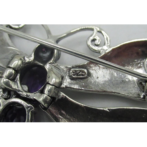 397 - Silver articulated butterfly brooch set with amethysts and marcasite, stamped 925, W6.5cm