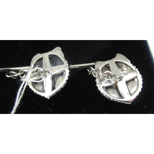 398 - Pair of silver wolf head cufflinks set with ruby eyes, stamped 925