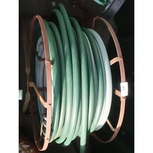 23 - Garden hose on a metal reel