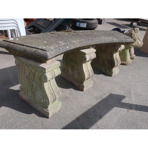 472 - Curved stone seat with three sandstone supports