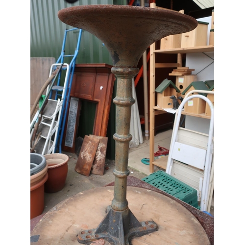 486 - Two pub style tables with cast bases and wooden tops