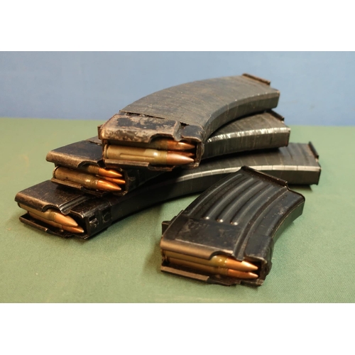 12 - Group of four various assorted rifle magazines, each containing inert rounds