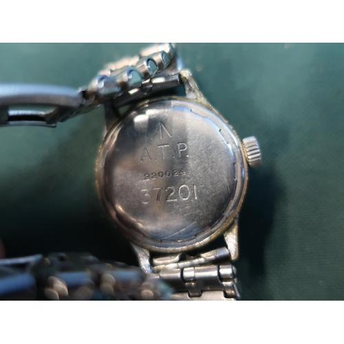 141 - Military wristwatch with reverse broad arrow mark A.T.P 220024 - 37201 with metal bracelet