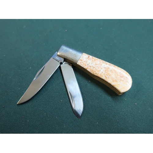 174 - Small, quality double bladed pocket knife, a clip blade and a spey blade with mottled polished hards... 