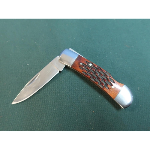 175 - Small steel pocket knife with wooden handle and carved effect grip L6cm