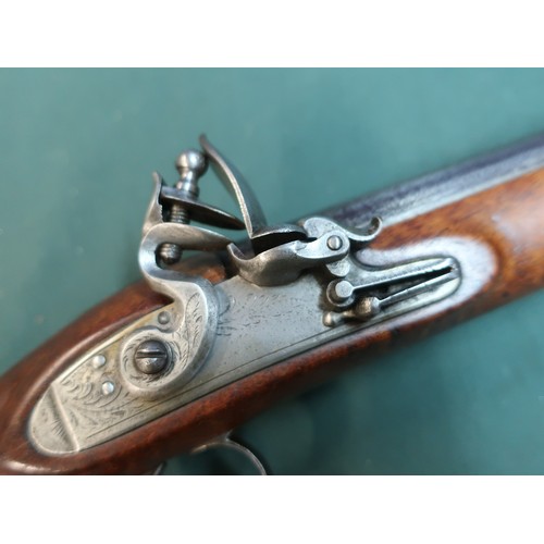 88 - George III officer’s flintlock pistol circa 1800.  Full smooth walnut stock with 22cm (8 ¾ “) round ... 