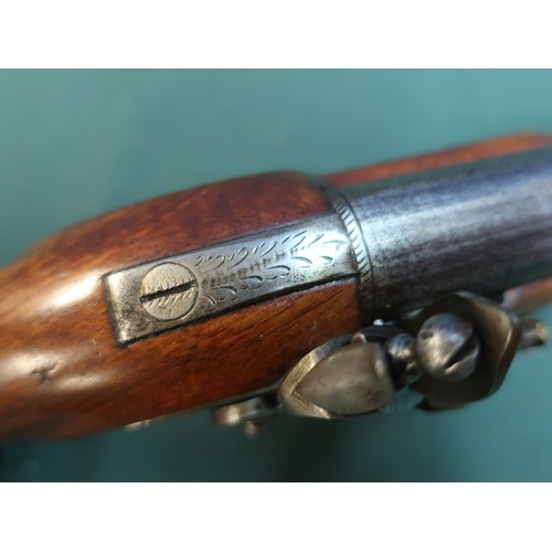 88 - George III officer’s flintlock pistol circa 1800.  Full smooth walnut stock with 22cm (8 ¾ “) round ... 