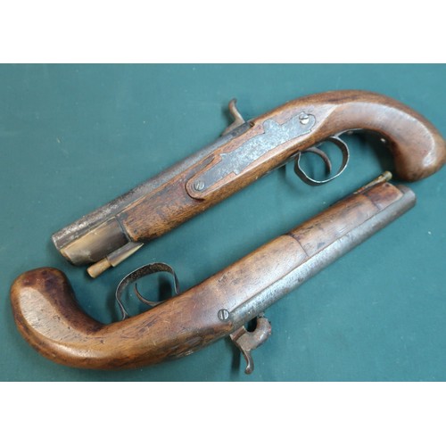 91 - Pair of decorative percussion cap pistols with cows horn forend mounts complete with ramrods (barrel... 