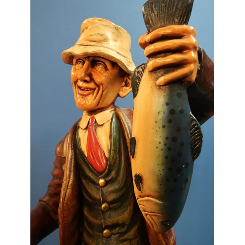 292 - Composite model of a fisherman with catch, in waders with rod and basket,  H76cm