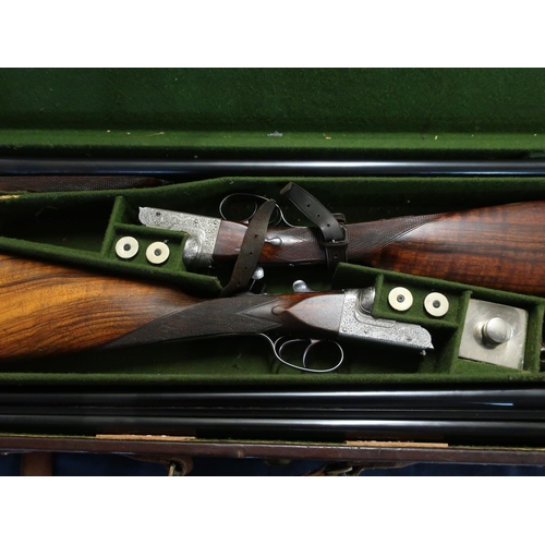 438 - Leather cased pair of William Ford 12 bore side by side boxed ejector shotguns with 26 inch barrels ... 