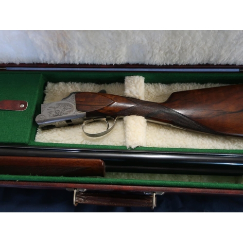 439 - Cased Browning BRG lightweight 12 bore over and under game gun with dingle trigger action and 27.5in... 