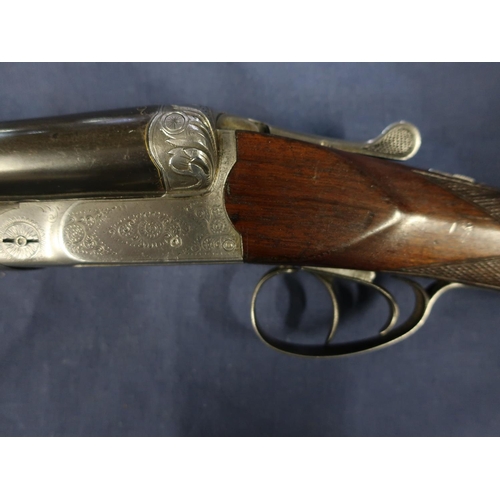 447 - Belgium 12B bar in action side by side shotgun, with 30 inch barrels with gilt scroll inlaid detail,... 