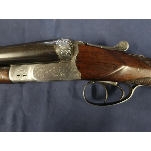 447 - Belgium 12B bar in action side by side shotgun, with 30 inch barrels with gilt scroll inlaid detail,... 