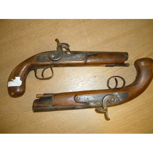 91 - Pair of decorative percussion cap pistols with cows horn forend mounts complete with ramrods (barrel... 