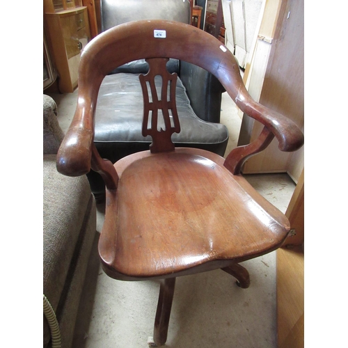 474 - Early 20th C mahogany office swivel chair with curved scroll back and arms on four scroll legs, with... 