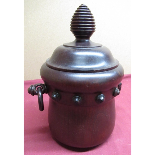 46 - 20th C mahogany biscuit barrel of cauldron form, twin handles and bee hive shaped finial