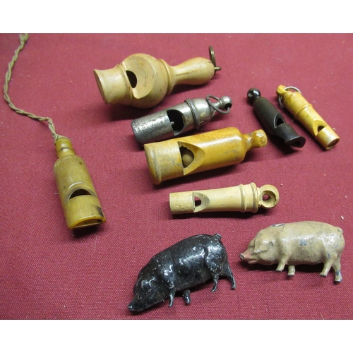 48 - 20th C plated whistle, a horn whistle, four tureen whistles and two Britains diecast painted pigs