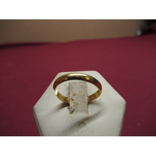 157 - 22ct gold hallmarked wedding band, 2.5g (cut)