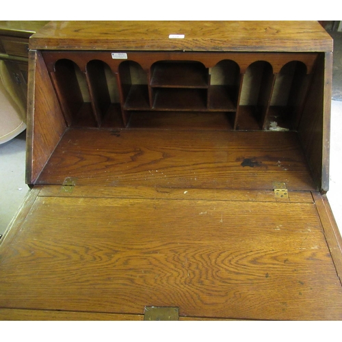 279 - 1930's oak bureau with geometrically molded fall front above two similar drawers on barley twist sup... 