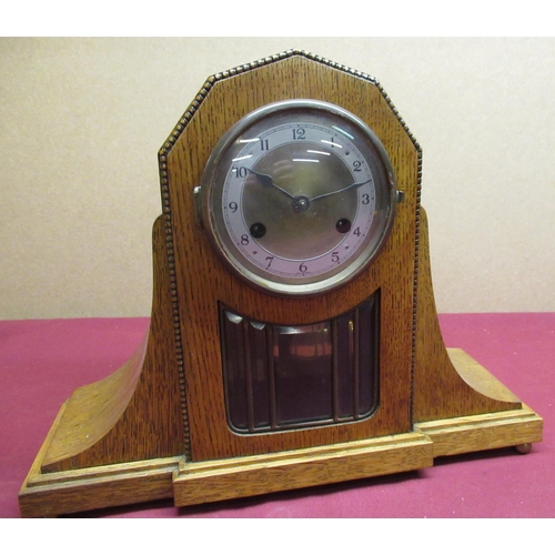 102 - Golden oak cased mantle clock two tone brass bezel enclosing brass dial and applied silvered chapter... 