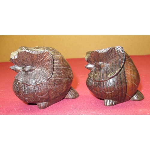 439 - Two carved rosewood owls, carved horn and bone miniature casket with pierced lid, papier Mache box d... 