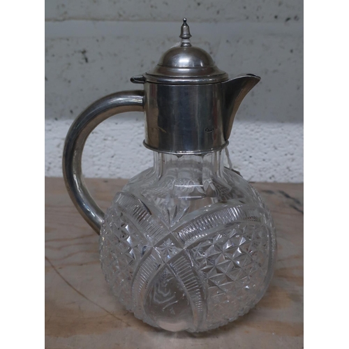 28 - Edwardian lead crystal ewer shaped claret decanter with later silver collar and handle, Birmingham 1... 