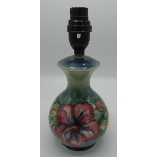 1221 - Moorcroft Hibiscus pattern mallet shaped table lamp, with impressed mark and part of old label on ba... 