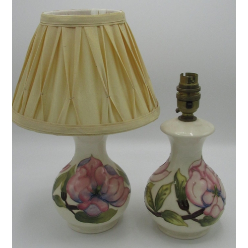 1222 - Pair of Moorcroft Magnolia pattern baluster shaped table lamps, with pleated ivory fabric shades, im... 