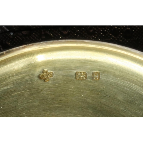 1097 - Geo.V1 hallmarked silver circular wafer box, cover engraved with a Bottony type cross and with gilt ... 