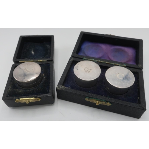 1099 - Geo.V hallmarked silver cylindrical wafer box, London 1945, a pair of ER11 similar boxes, London 196... 
