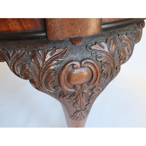 1318 - Geo.III style mahogany extending dining table, with gadroon carved oval top on C scroll carved legs ... 