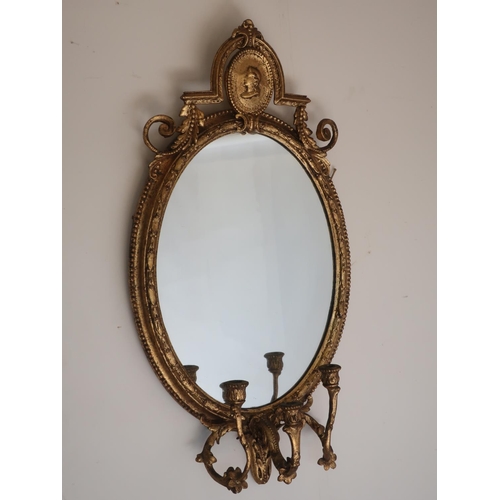 1287 - Regency style carved giltwood and gesso girandole mirror, oval plate with portrait cresting, three s... 
