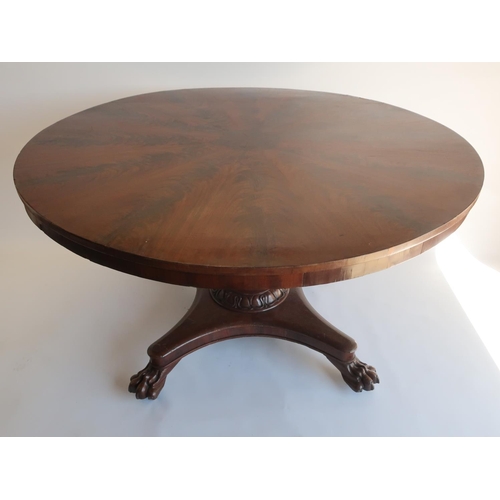 1289 - Regency mahogany breakfast table, circular segmented curl veneer top on angular vase and lotus carve... 