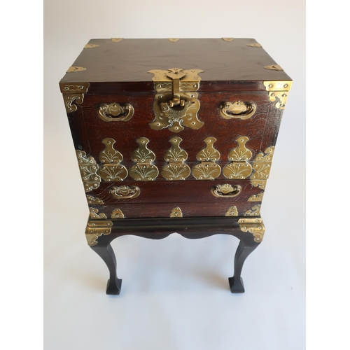 1314 - 20th C Japanese brass bound elm cabinet on stand, fall front above a drawer on angular cabriole legs... 