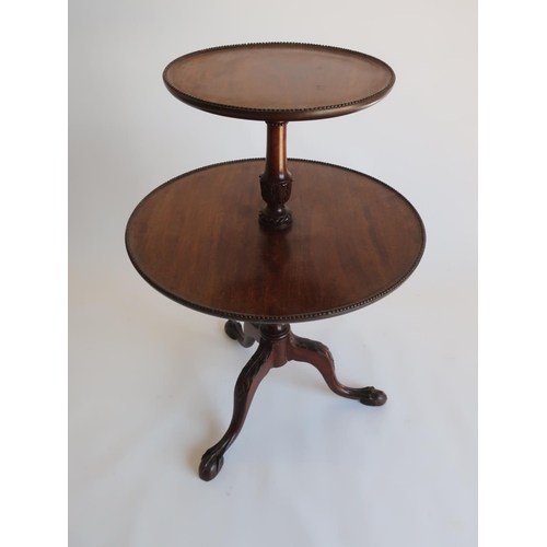 1317 - Geo.III style mahogany dumb waiter, two graduated circular tiers with beaded edge on leaf carved col... 