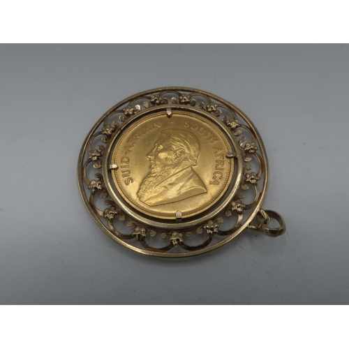 1140 - South African Kruggerand, 1974, in 9ct gold hallmarked circular pierced scroll loose mount, 41.8g gr... 