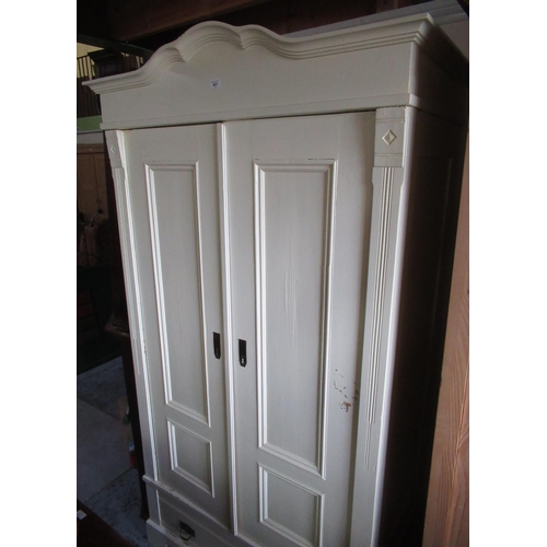 513 - Craftsman made painted pine wardrobe with arched cornice, two panel doors above single drawer on sha... 