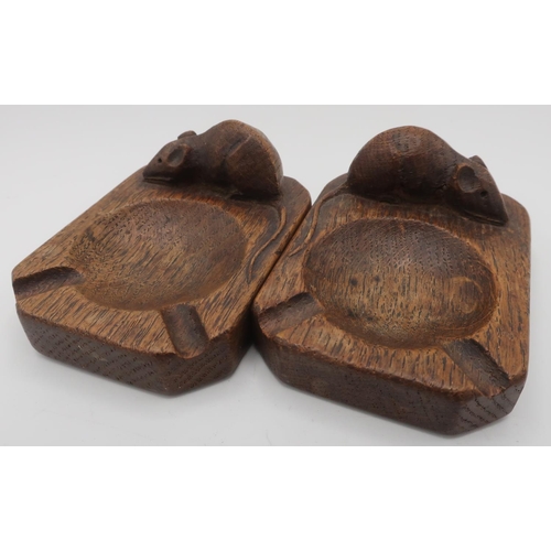 1011 - Robert Mouseman Thompson - a pair of adzed oak ashtrays, carved left and right facing, carved with s... 