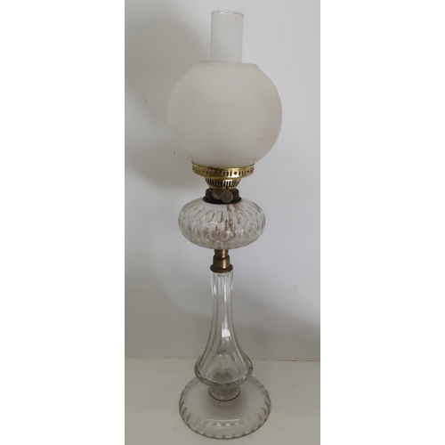 1164 - Edwardian clear glass oil lamp, with faceted tapering column,circular base and resevoir, opaque glas... 