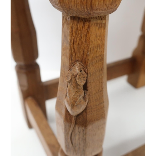 1053 - Robert Mouseman Thompson - an oak joint type stool with rectangular top on four octagonal baluster l... 